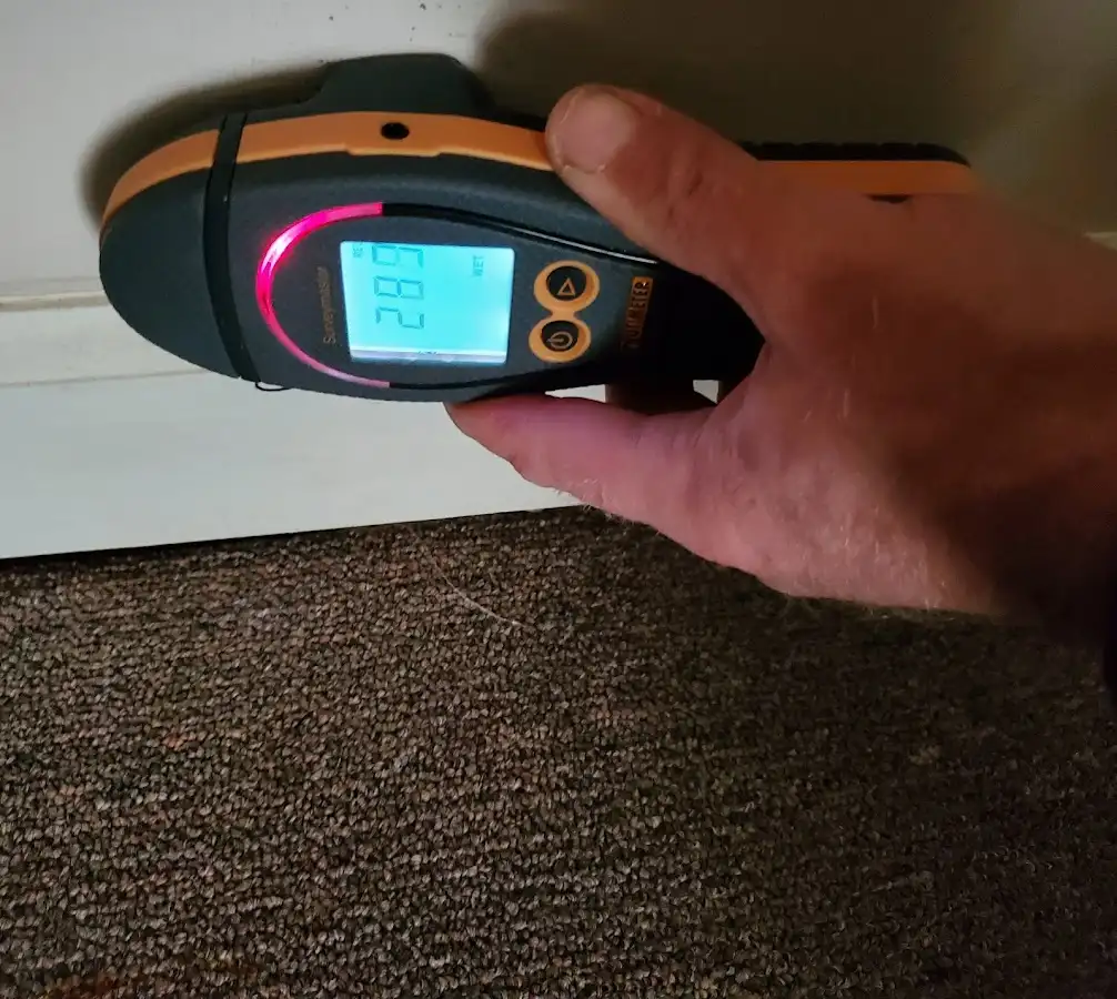 Moisture detection at baseboard during Burst Pipe Cleanup in University City